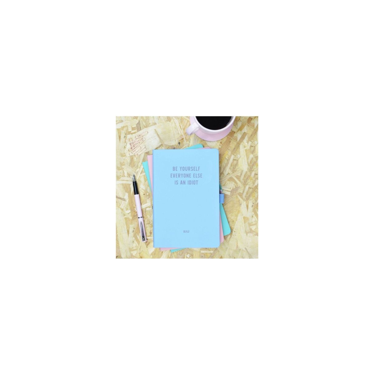  Be Yourself Everyone Else is an Idiot Blue & Purple Personalised Notebook Cute blue hardback PU notebook with purple 'Be Yourself Everyone Else is an Idiot' slogan. Baby blue PU notebook with 96 blue edged pages, elastic fastening and pen holder.